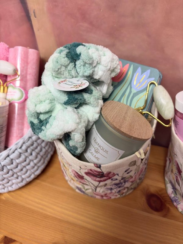 Phone photo of a green spa-themed gift basket